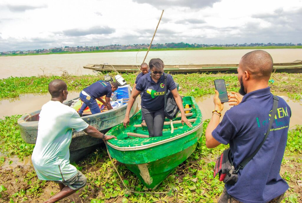 Uchenna Onwuamaegbu-Ugwu coming out from a flying boat by the Niger River